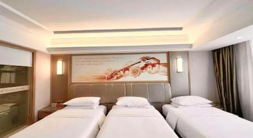 Bed in Vienna Hotel Guangxi Zhongshan Central Plaza West High-Speed Railway Station