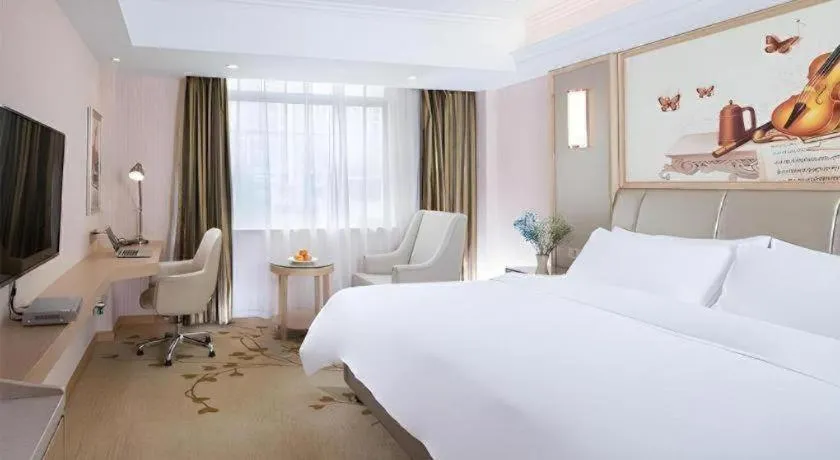 Bed in Vienna Hotel Guangxi Zhongshan Central Plaza West High-Speed Railway Station
