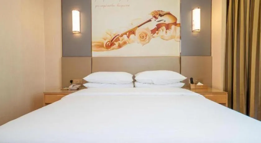 Bed in Vienna Hotel Fuzhou Changle Zhenghe Metro Station