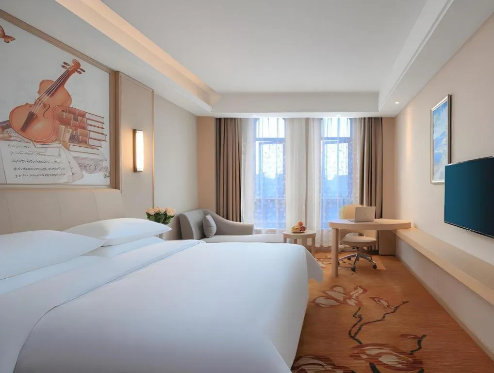 Bed in Vienna Hotel Zhejiang Tongxiang Puyuan