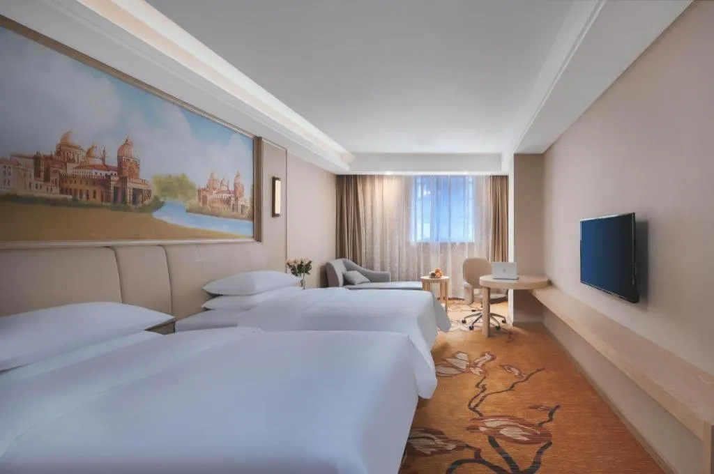 Bed in Vienna Hotel Zhejiang Tongxiang Puyuan