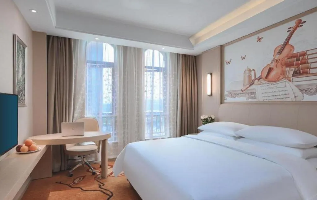 Bed in Vienna Hotel Zhejiang Tongxiang Puyuan