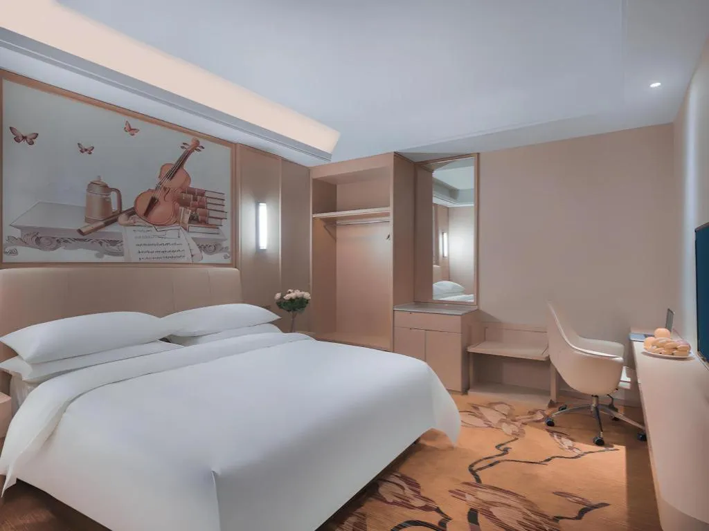 Bed in Vienna Hotel Zhejiang Tongxiang Puyuan