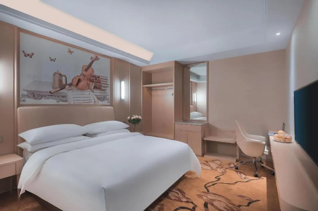 Bed in Vienna Hotel Zhejiang Tongxiang Puyuan