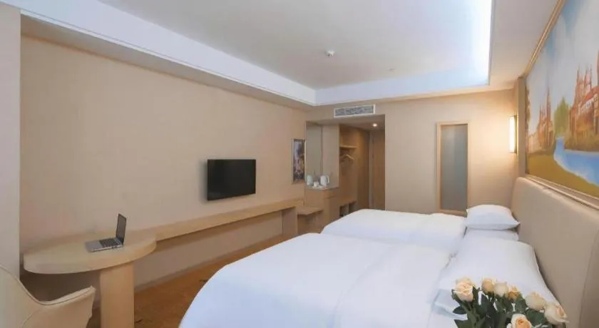 Bed in Vienna Hotel Zhejiang Tongxiang Puyuan