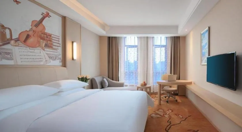 Bed in Vienna Hotel Zhejiang Tongxiang Puyuan