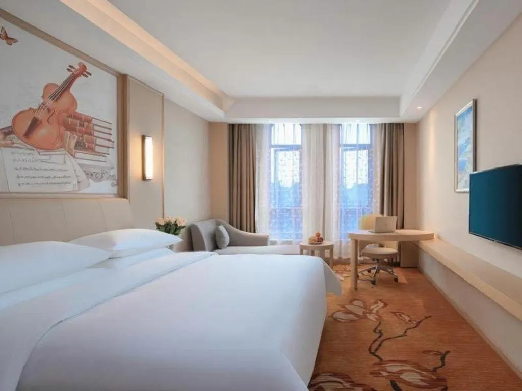 Bed in Vienna Hotel Zhejiang Tongxiang Puyuan