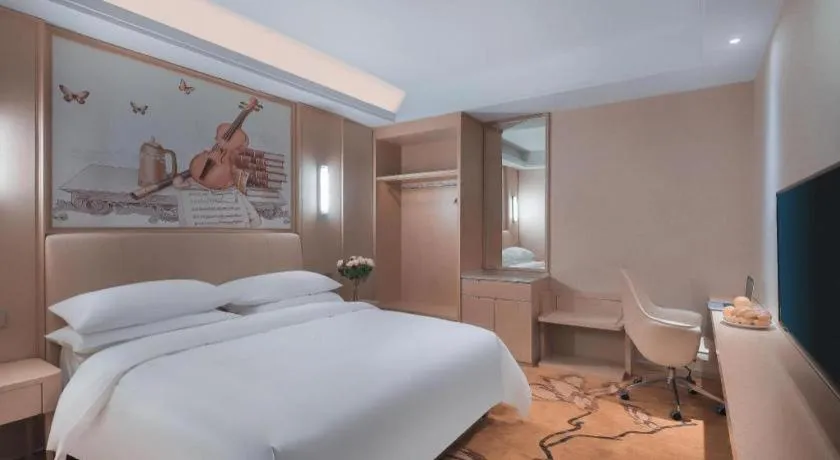 Bed in Vienna Hotel Zhejiang Tongxiang Puyuan