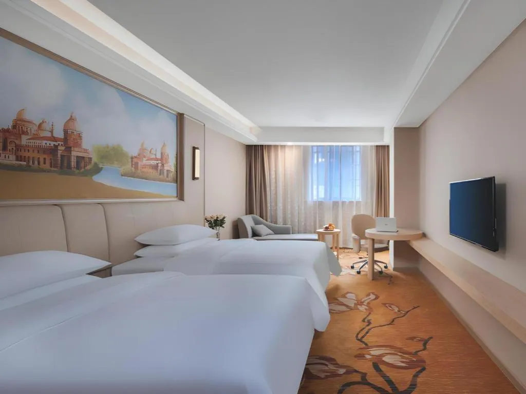 Bed in Vienna Hotel Zhejiang Tongxiang Puyuan