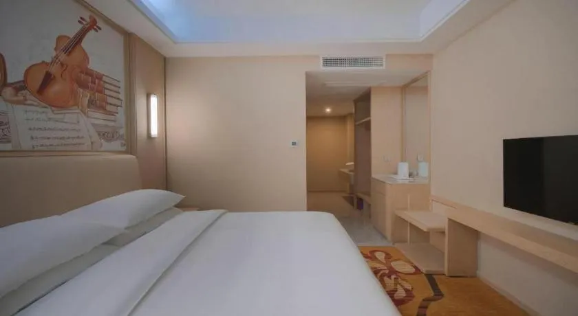 Bed in Vienna Hotel Zhejiang Tongxiang Puyuan