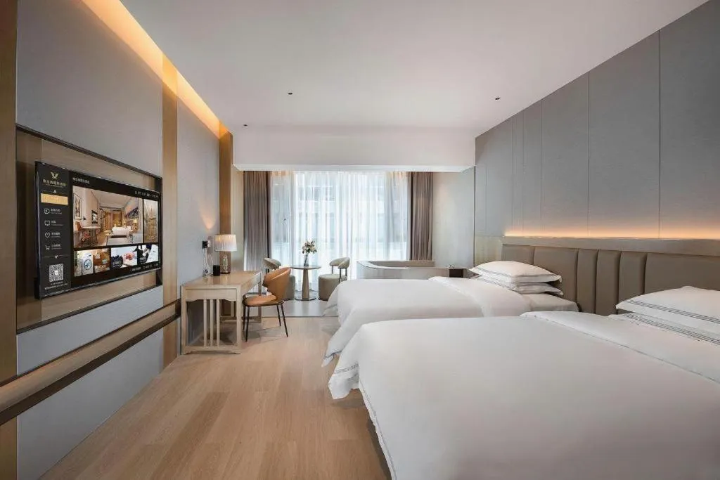 Bed in Vienna Hotel Yunnan Maitreya Huquan