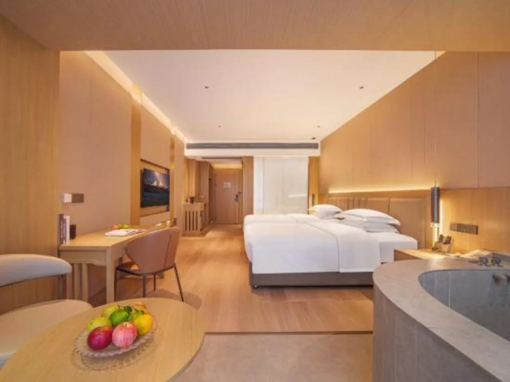 Bed in Vienna Hotel Yunnan Maitreya Huquan