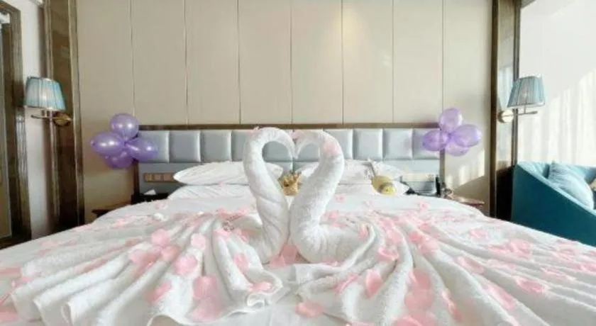 Bed in Vienna Hotel Yunnan Maitreya Huquan