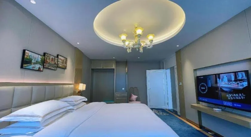 Bed in Vienna Hotel Yunnan Maitreya Huquan