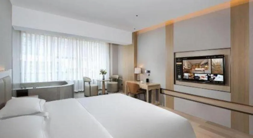 Bed in Vienna Hotel Yunnan Maitreya Huquan