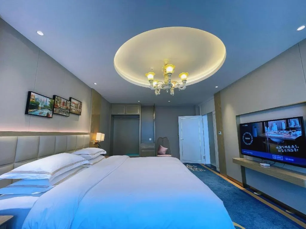 Bed in Vienna Hotel Yunnan Maitreya Huquan