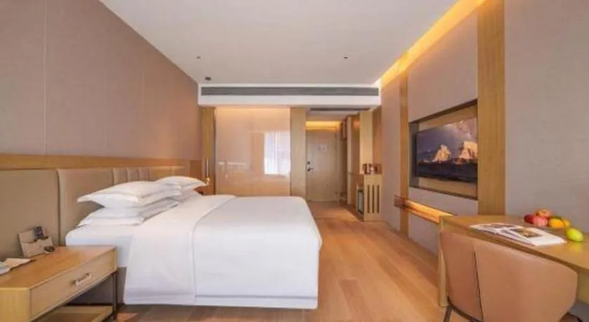 Bed in Vienna Hotel Yunnan Maitreya Huquan