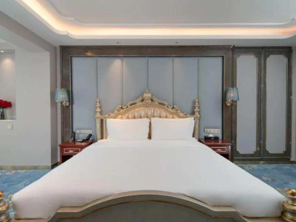 Bed in Vienna Hotel Yunnan Maitreya Huquan