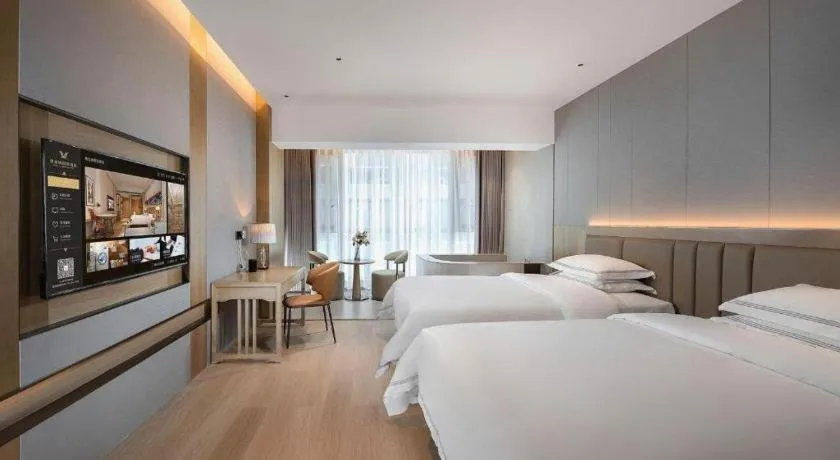 Bed in Vienna Hotel Yunnan Maitreya Huquan