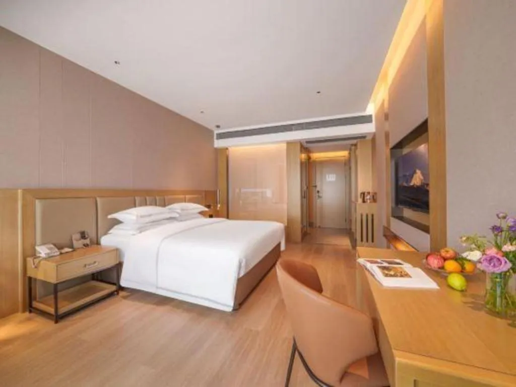 Bed in Vienna Hotel Yunnan Maitreya Huquan