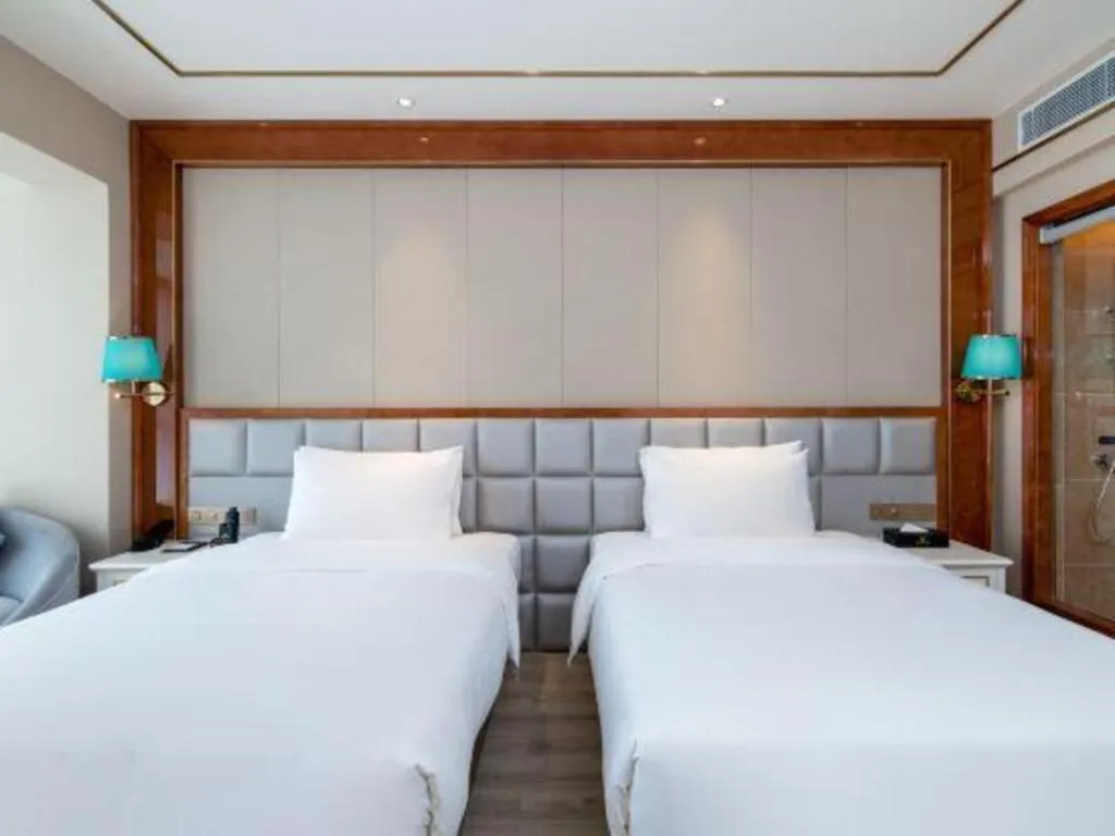 Bed in Vienna Hotel Yunnan Maitreya Huquan