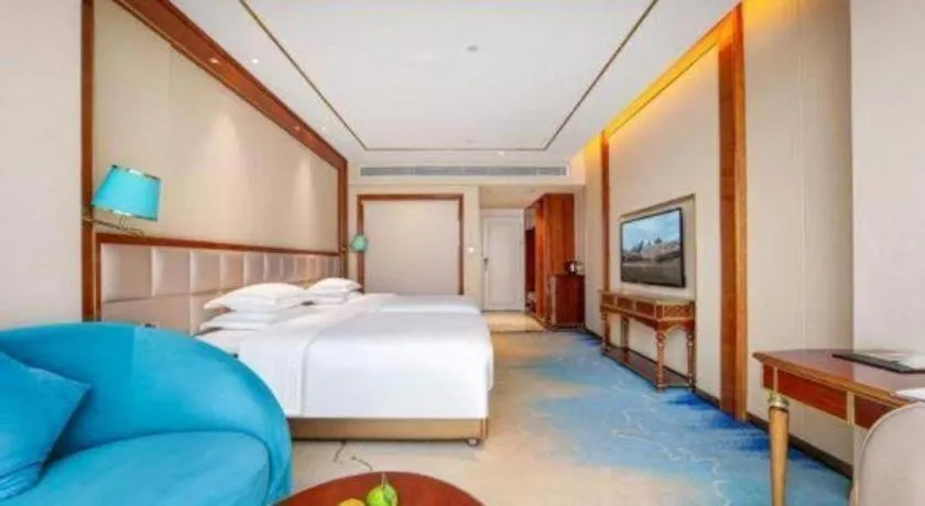 Bed in Vienna Hotel Yunnan Maitreya Huquan