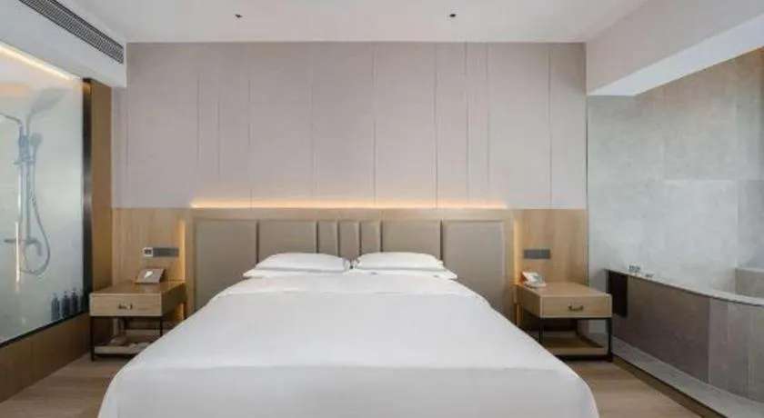 Bed in Vienna Hotel Yunnan Maitreya Huquan