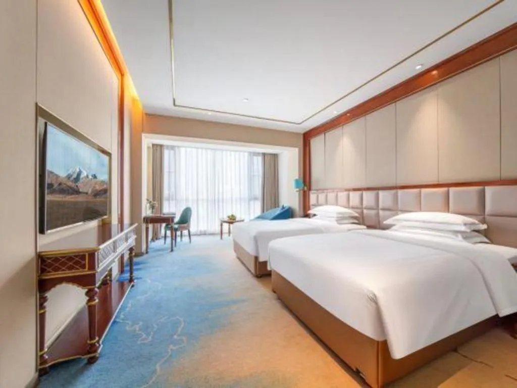 Bed in Vienna Hotel Yunnan Maitreya Huquan