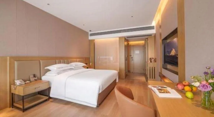 Bed in Vienna Hotel Yunnan Maitreya Huquan