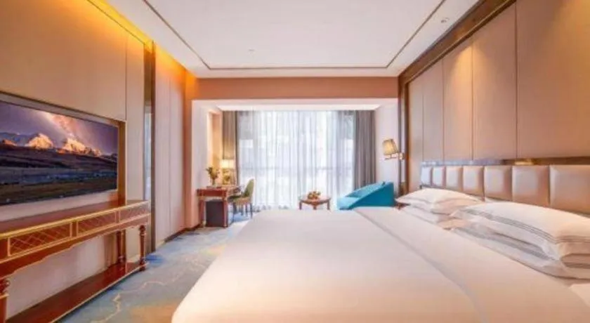 Bed in Vienna Hotel Yunnan Maitreya Huquan