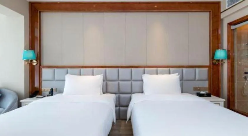 Bed in Vienna Hotel Yunnan Maitreya Huquan