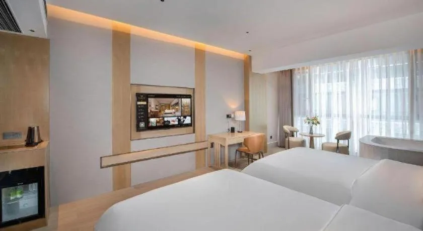 Bed in Vienna Hotel Yunnan Maitreya Huquan