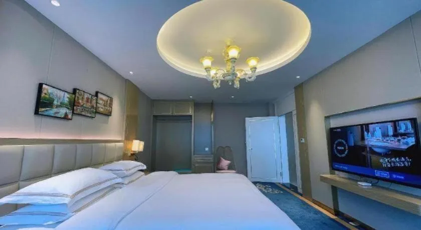 Bed in Vienna Hotel Yunnan Maitreya Huquan