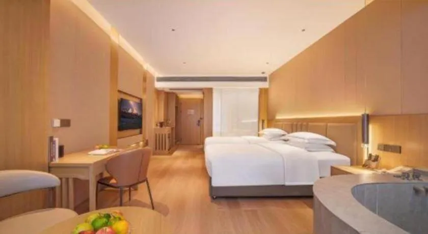 Bed in Vienna Hotel Yunnan Maitreya Huquan