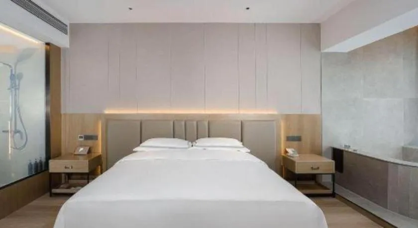 Bed in Vienna Hotel Yunnan Maitreya Huquan