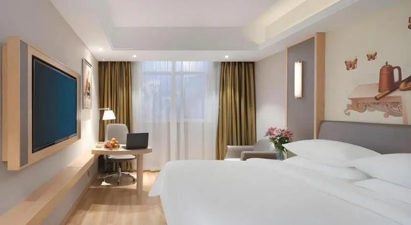 Bed in Vienna Hotel Shanghai Hongqiao Hub National Exhibition Center Huqingping Road