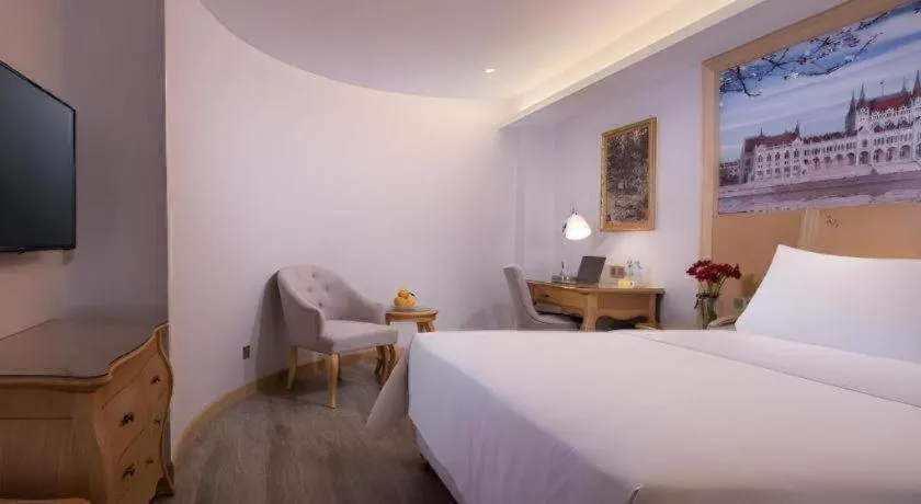 Bed in Vienna Hotel Guangdong Huizhou Huabianling Square