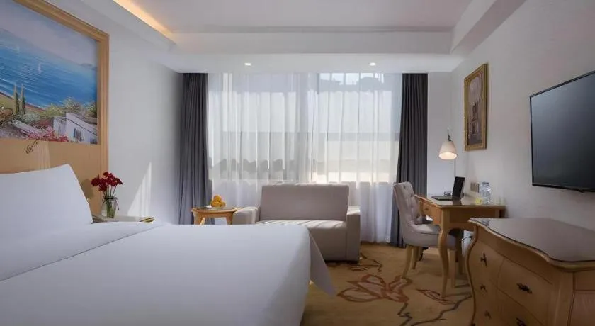 Bed in Vienna Hotel Guangdong Huizhou Huabianling Square