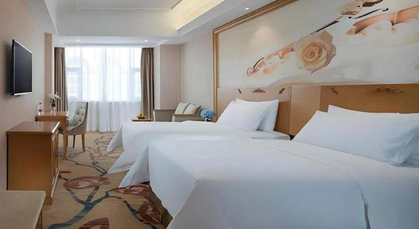Bed in Vienna Hotel Guangxi Yulin Rong County Guinan Road
