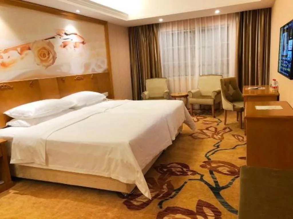 Bed in Vienna Hotel Guangxi Yulin Rong County Guinan Road
