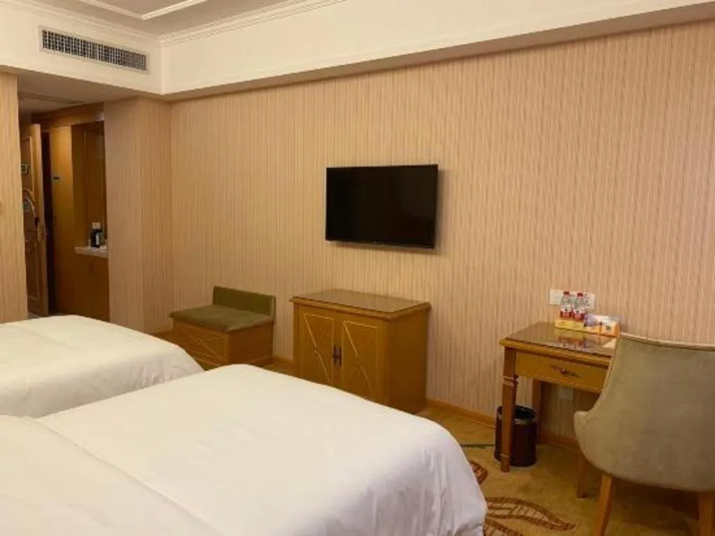 Bed in Vienna Hotel Guangxi Yulin Rong County Guinan Road