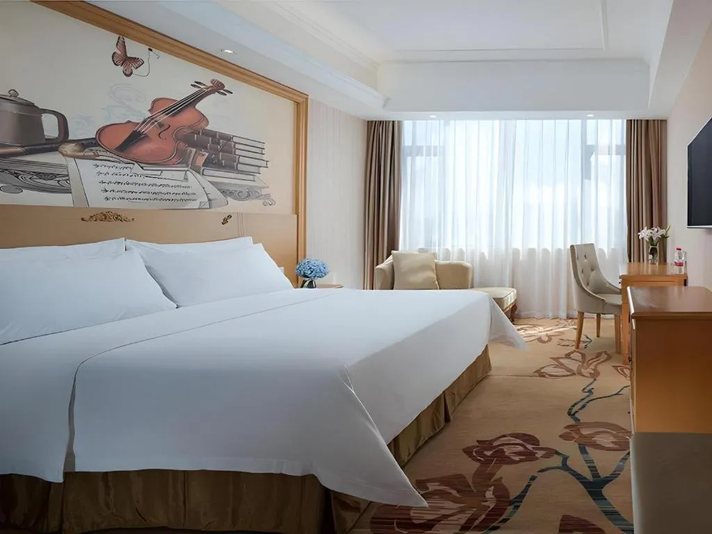 Bed in Vienna Hotel Guangxi Yulin Rong County Guinan Road