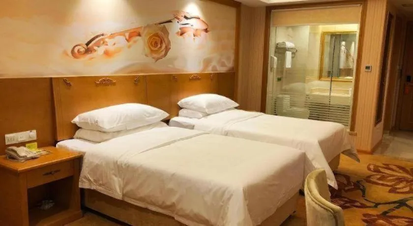 Bed in Vienna Hotel Guangxi Yulin Rong County Guinan Road