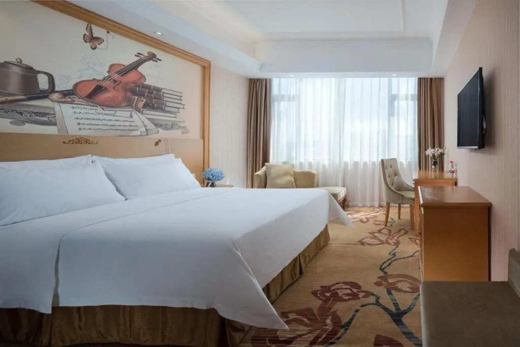 Bed in Vienna Hotel Guangxi Yulin Rong County Guinan Road