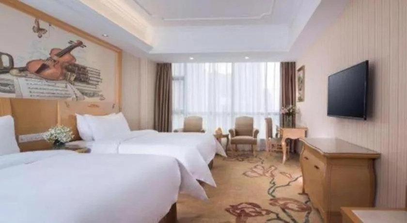 Bed in Vienna Hotel Guangxi Yulin Rong County Guinan Road