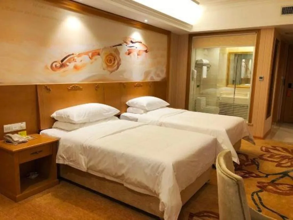 Bed in Vienna Hotel Guangxi Yulin Rong County Guinan Road