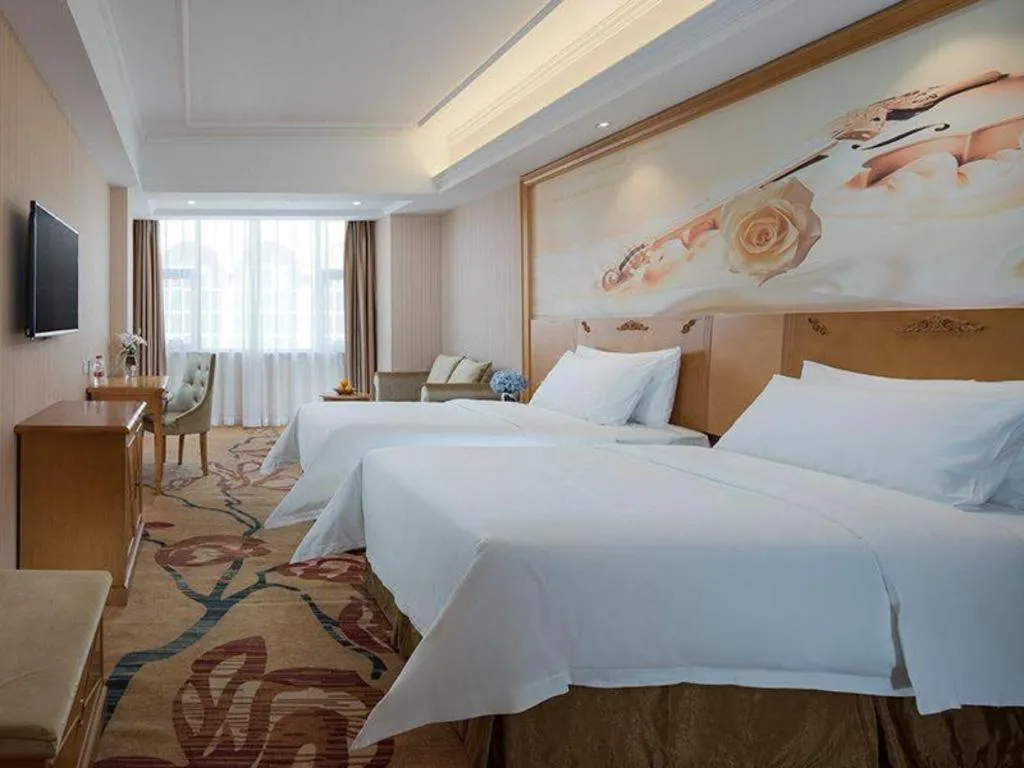 Bed in Vienna Hotel Guangxi Yulin Rong County Guinan Road