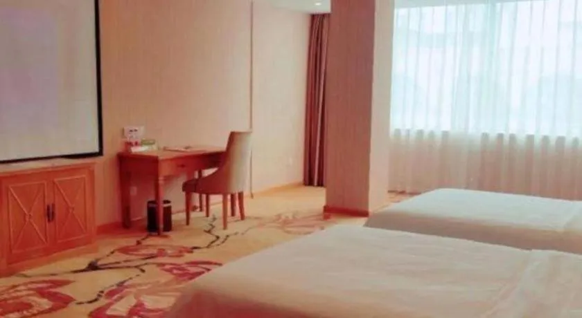 Bed in Vienna Hotel Guangxi Yulin Rong County Guinan Road