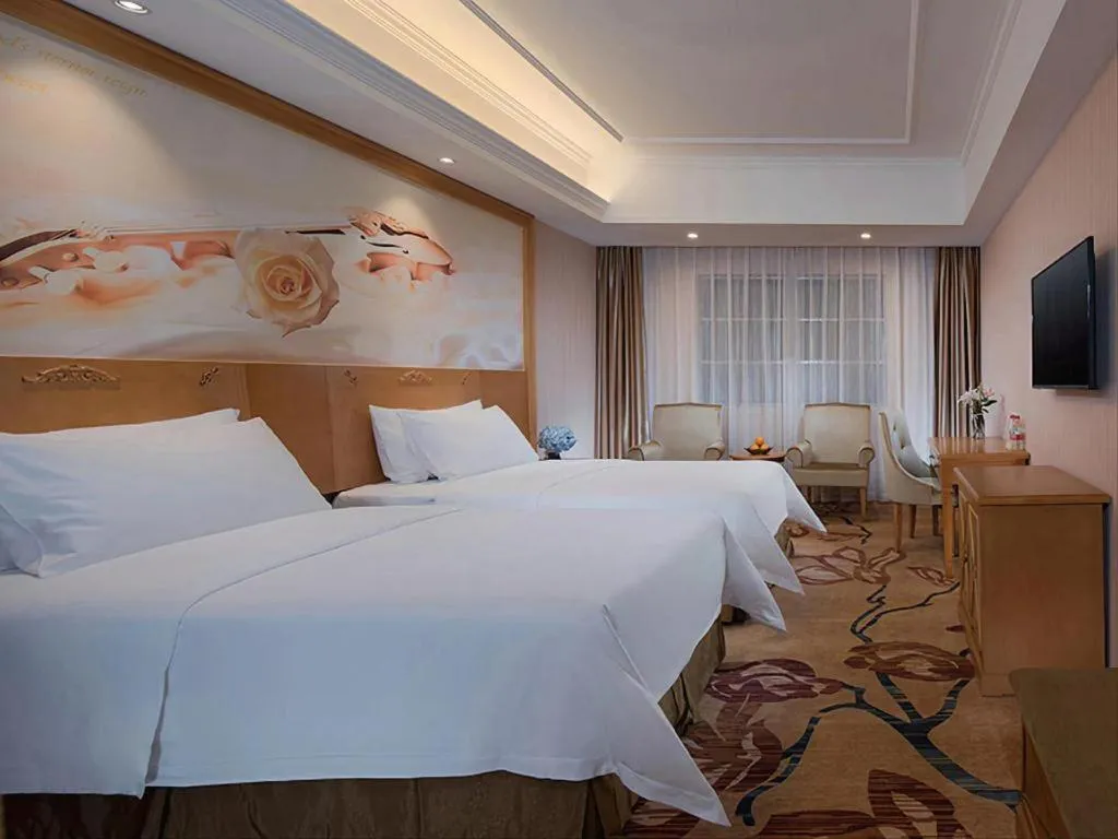 Bed in Vienna Hotel Guangxi Yulin Rong County Guinan Road