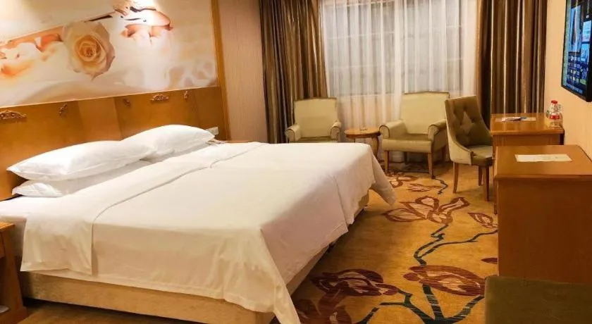 Bed in Vienna Hotel Guangxi Yulin Rong County Guinan Road